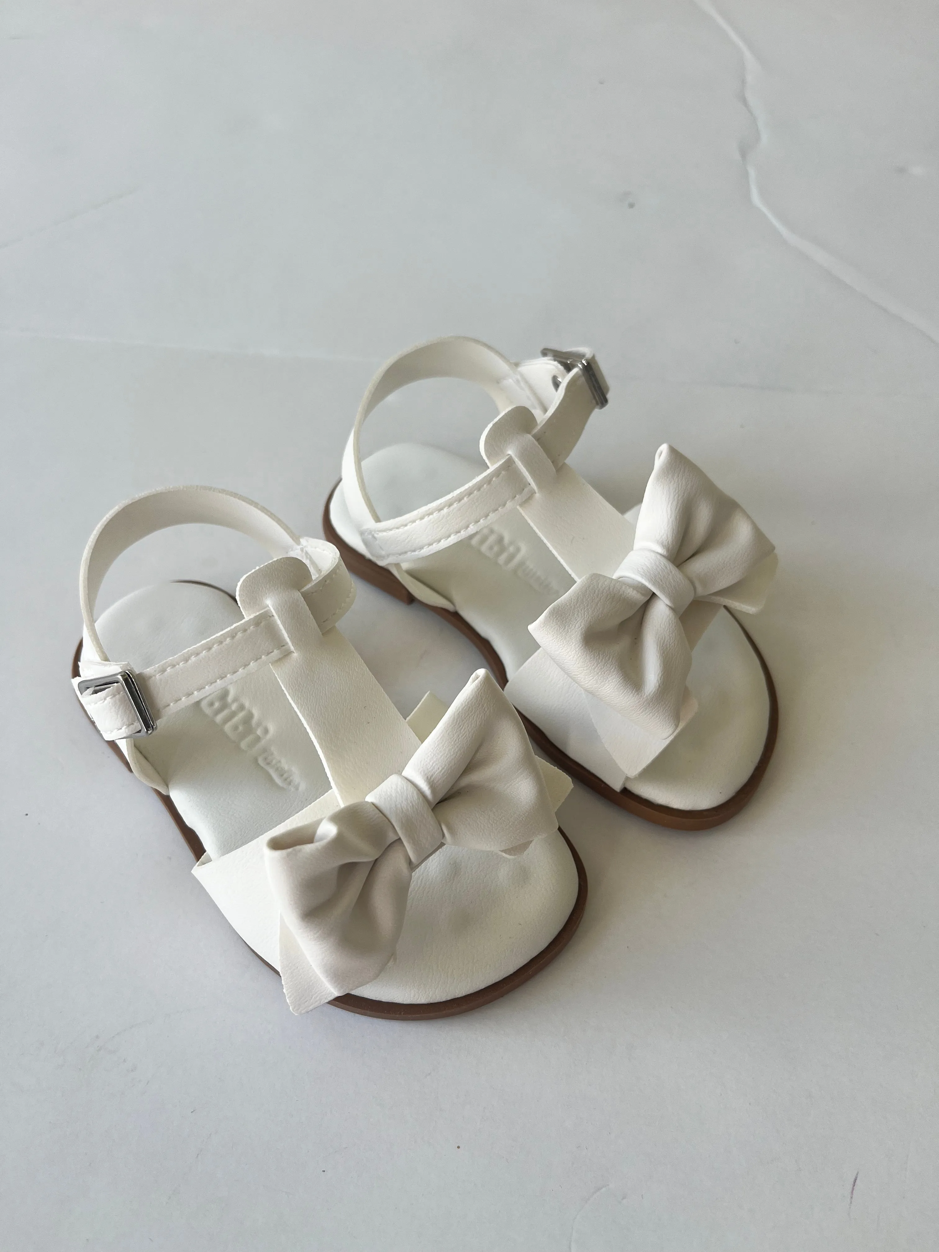 White sandal with bow